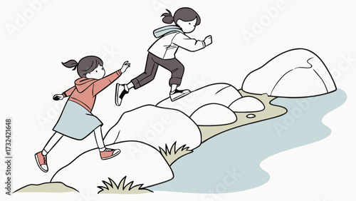 Two young girls are helping each other cross a stream by stepping on rocks.