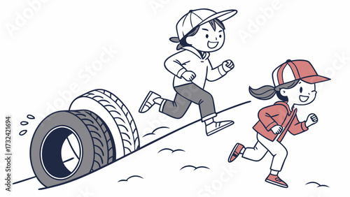 Two young girls are running downhill next to a rolling tire, smiling and enjoying the playful activity.