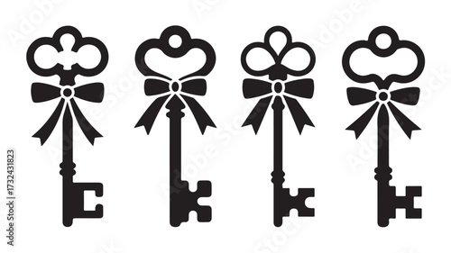 Four ornate antique skeleton keys with decorative bows on a white background vintage
