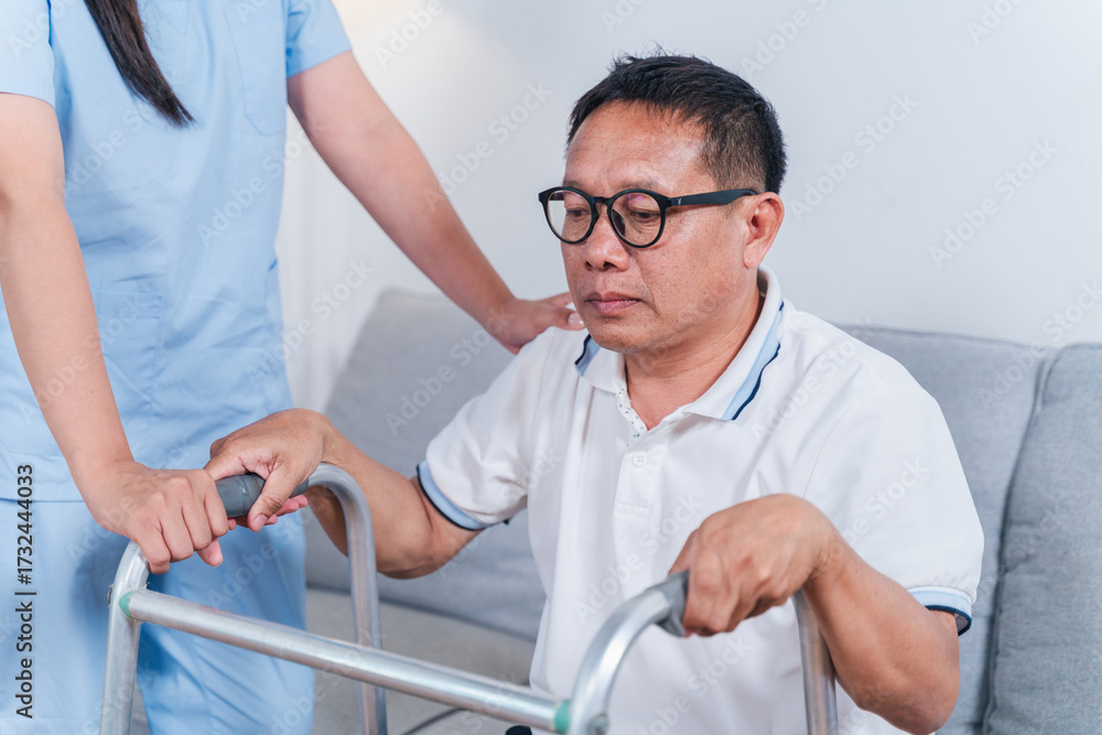 Obraz premium Supportive Caregiver Assisting Senior Man with Walker in Modern Home Environment During Rehabilitation Process for Mobility Improvement