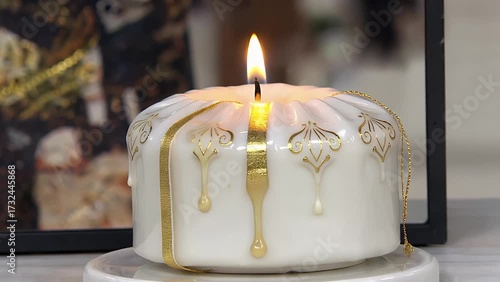 Fragrant Illuminating Wax Cylinder Emitting Visible Flame While Positioned on Pale Background, Potential Present Item