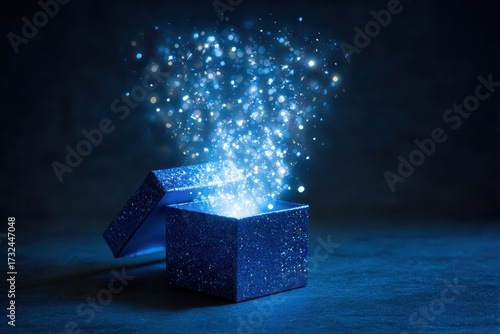 Blue open gift box with magical light