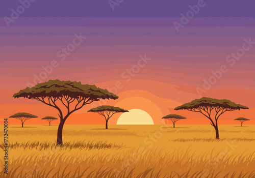 Sunset over the savanna tranquil landscape in african nature warm colors wide viewpoint