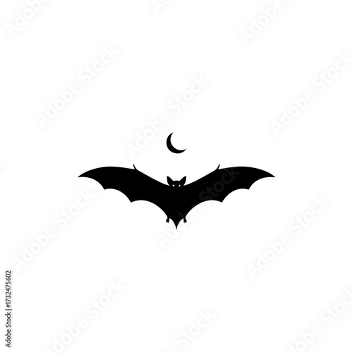Silhouette of a bat flying in front of the moon.