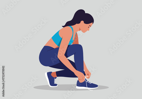 Active woman tying shoes before workout gym environment fitness motivational viewpoint