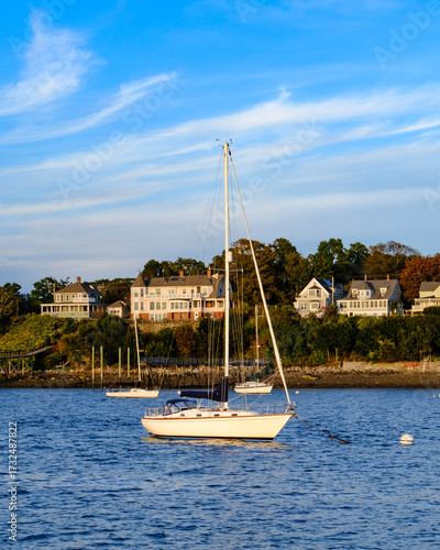 Peaks Island Maine afternoon view with a boat in the foreground