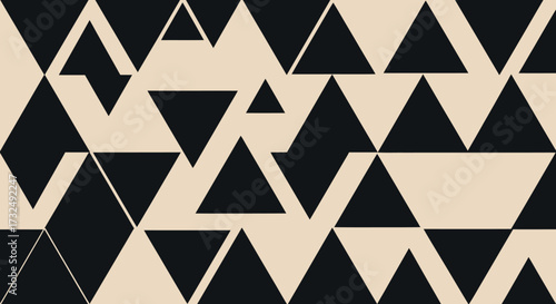 Triangle pattern. Black triangles on beige, some are partial, in dynamic arrangement