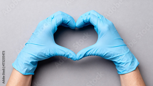 Blue Gloves Forming Heart Gesture
