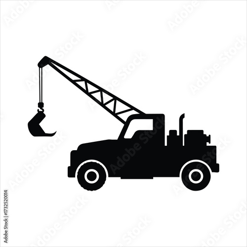 Silhouette of a vintage tow truck with extended crane and hook ready for heavy lifting duty
