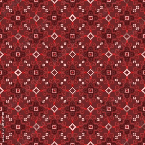 red seamless pattern. Intricate red pattern with diamond and floral-like motifs in a woven style.