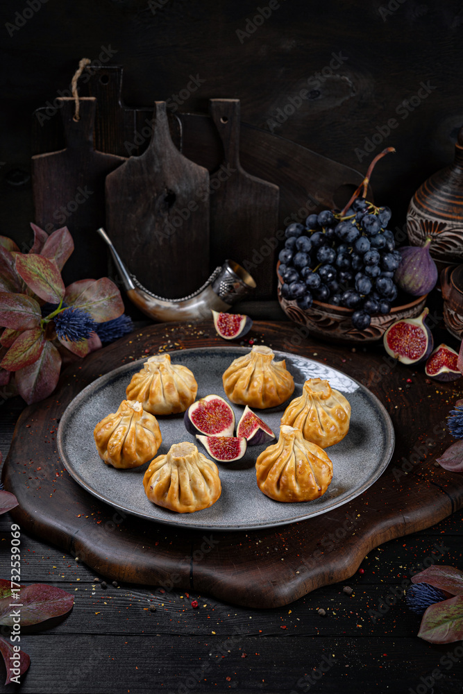 Fototapeta premium Fried Khinkali – Golden Georgian Dumplings.Traditional Georgian Bread. Traditional Georgian cuisine styled with authentic atmosphere.