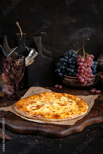 Cheese Khachapuri – Classic Georgian Bread. Traditional Georgian Bread. Traditional Georgian cuisine styled with authentic atmosphere.