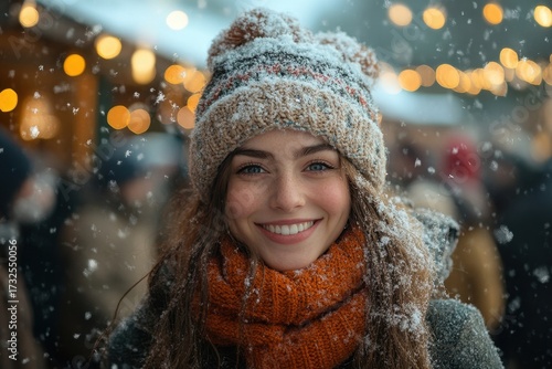 Woman in hat and scarf in snow.