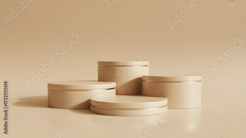 Four round beige platforms with gold accents arranged on a beige surface in a studio setting abstract wallpaper