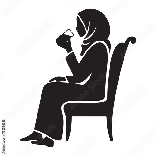 Woman wearing hijab sitting on a chair and drinking from a glass silhouette