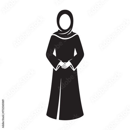 Elegant islamic woman wearing a traditional abaya and hijab in a striking silhouette