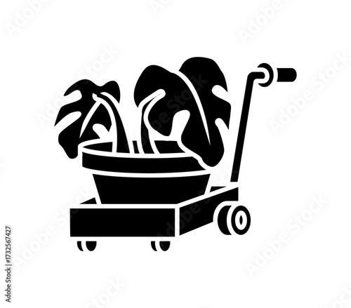 Stylish monstera plant in pot being moved on a black trolley, perfect for home decor, gardening, and plant enthusiast themes