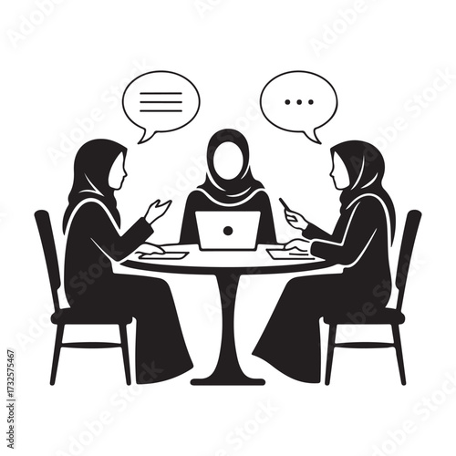 Three muslim women in hijab having a discussion around a table with a laptop silhouette