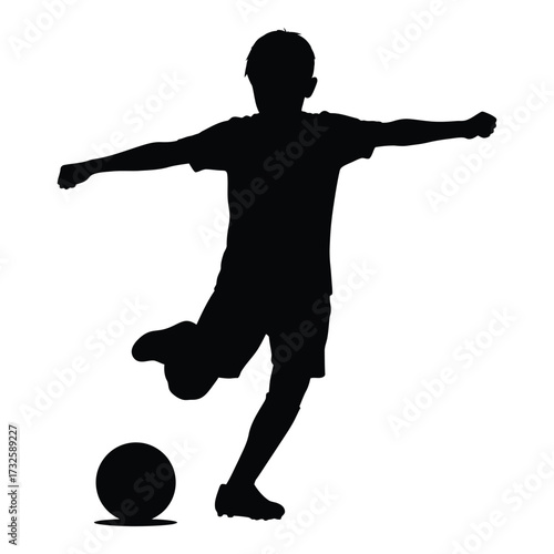 Silhouette of a young boy kicking a soccer ball in a dynamic pose representing athleticism and sports action silhouette