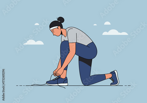 Woman tying shoelaces in outdoor setting active lifestyle calm blue sky background