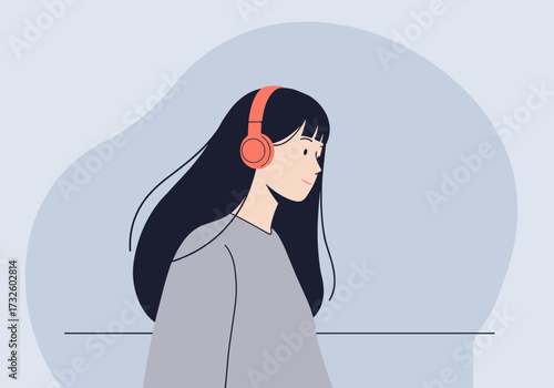 Walking woman with headphones urban setting digital calm environment side view listening to music