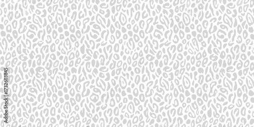Seamless light gray leopard print pattern on a white background for fashion and design