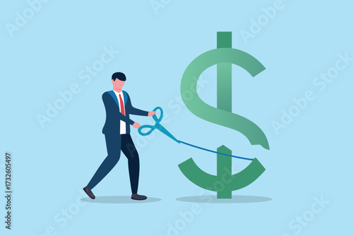 Businessman cutting a large green dollar sign with scissors symbolizing financial cuts or budget reduction