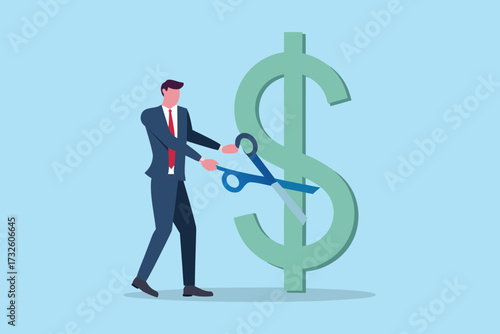 Businessman cutting a large green dollar sign with scissors symbolizing financial cuts or savings