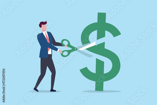 Businessman cutting a large green dollar sign with scissors symbolizing financial cuts and cost reduction