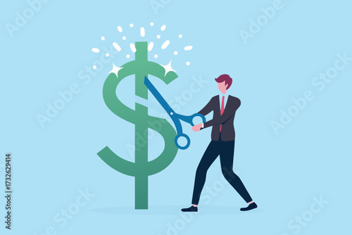 Businessman cutting a large green dollar sign with scissors symbolizing financial cuts or savings