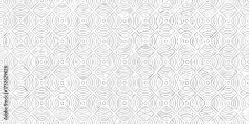 Intricate white geometric pattern with repeating circular and diamond shapes