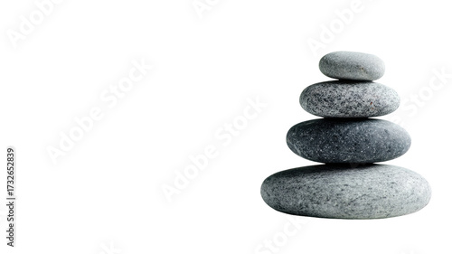 Balanced gray zen stones stacked delicately in vertical pile showing harmony, meditation, and spa relaxation concept isolated on white background