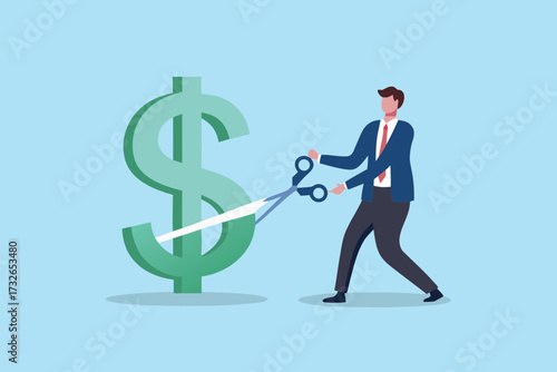 Businessman cutting a large green dollar sign with scissors symbolizing financial cuts or savings