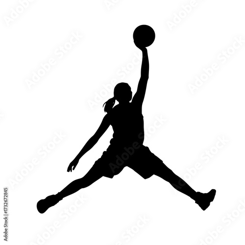 Athlete performs a slam dunk in mid-air during a basketball game at a local gym in the evening