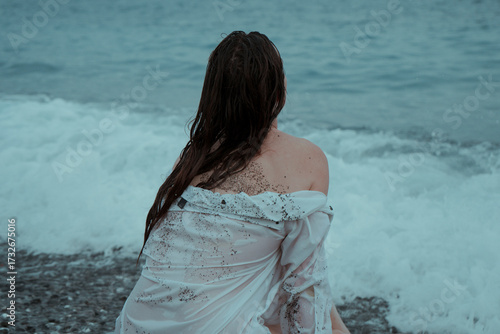 Woman by the sea very emotional