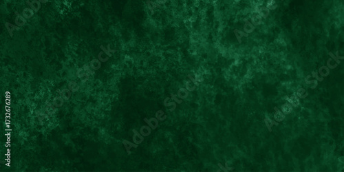 Abstract Elegant dark green background with mottled vintage texture in old fancy background design, texture of colored parchment paper.