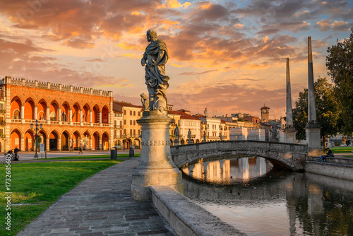 Fototapeta Naklejka Na Ścianę i Meble -  View of canal with statues on square Prato della Valle and Lodge Amulea also known as Ca' Duodo Palazzo Zaccoin Padova (Padua), Veneto, Italy. Architecture and landmarks of Padua.
