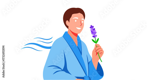 Man in a blue robe smelling a fresh lavender flower.