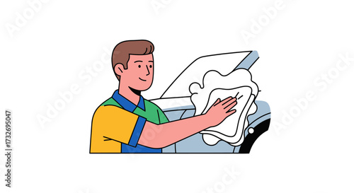 Professional auto detailer carefully cleaning a car surface with a cloth.
