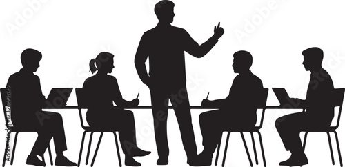Black silhouette of a man standing and gesturing to a group of people sitting at a table with laptops and notebooks