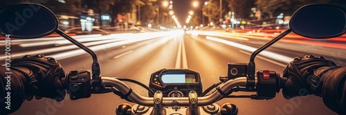 The point of view of a person riding a motorcycle at night, capturing the motion blur of city traffic