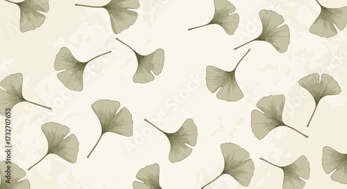 A gentle scattering of autumn ginkgo leaves against a soft neutral background.