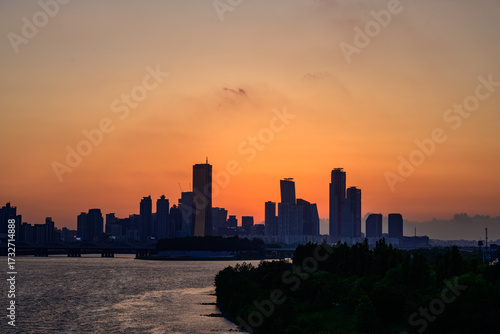 The night view of the city of Yeouido, a high-rise building, shot at Dongjak Bridge in Seoul at sunset