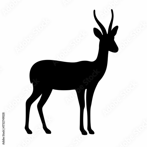 Silhouette of a slender antelope standing elegantly against a white backdrop