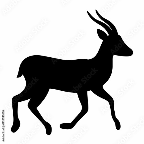 Black Silhouette of an African Antelope with Long Curved Horns Walking