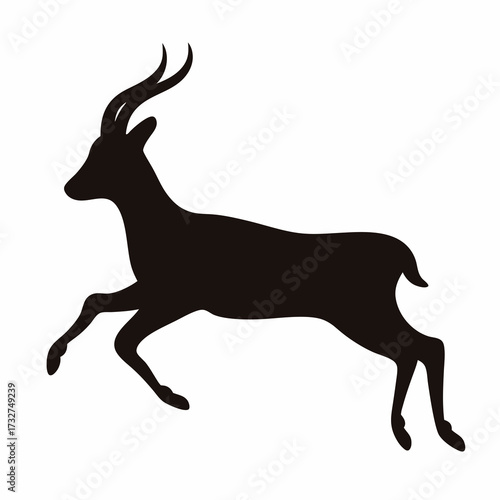 Silhouette of a majestic horned animal leaping gracefully against a white backdrop