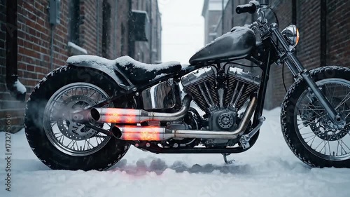 Powerful motorcycle engine roars to life in snowy urban alleyway with glowing exhausts