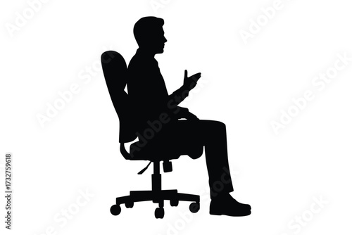 Silhouette of a man sitting in an office chair and talking