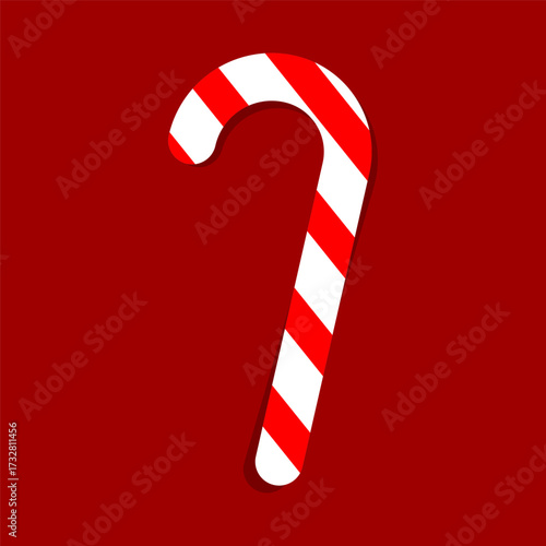 Simple Christmas sweet red and white sugar cane flat lay on dark red background