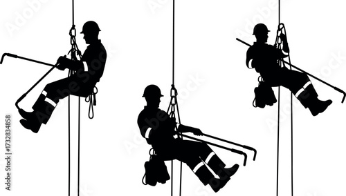 Industrial rope access workers suspended mid-air performing high-altitude maintenance tasks with safety gear, harnesses, helmets, and long tools.